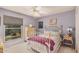 Bedroom with ceiling fan, dresser, window view and decor at 2448 S Standage --, Mesa, AZ 85202