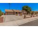 Inviting ranch-style home with a brick driveway, arched entryway, and well-maintained desert landscaping at 2448 S Standage --, Mesa, AZ 85202