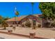 Inviting front of the home with charming desert landscaping and a welcoming entrance at 2448 S Standage --, Mesa, AZ 85202