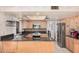 Well-lit kitchen with stainless steel appliances and ample counter space for food preparation at 2448 S Standage --, Mesa, AZ 85202