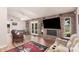 Cozy living room with a brick fireplace, access to backyard, and comfortable seating at 2448 S Standage --, Mesa, AZ 85202