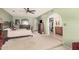 Spacious main bedroom features an ensuite bathroom, large closet, and ceiling fan at 2448 S Standage --, Mesa, AZ 85202