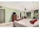 The main bedroom has an ensuite bathroom, large closet, a ceiling fan, and views of the backyard at 2448 S Standage --, Mesa, AZ 85202