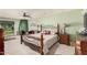 Spacious main bedroom with fireplace, comfortable seating area, and outside views at 2448 S Standage --, Mesa, AZ 85202