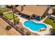 Beautiful backyard with a sparkling pool, covered patio, and putting green for outdoor enjoyment at 2448 S Standage --, Mesa, AZ 85202