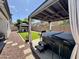 Backyard with a hot tub and pergola, artificial turf, rock landscaping, and a privacy fence at 2715 E Canyon Creek Dr, Gilbert, AZ 85295