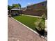 Spacious backyard featuring a gazebo and synthetic grass for low-maintenance outdoor enjoyment at 2715 E Canyon Creek Dr, Gilbert, AZ 85295