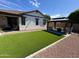 Beautiful backyard boasts lush synthetic grass and a gazebo with seating area at 2715 E Canyon Creek Dr, Gilbert, AZ 85295