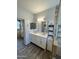 Bathroom with double sink vanity, tile floor, and a glass-enclosed shower in the background at 2715 E Canyon Creek Dr, Gilbert, AZ 85295