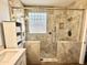 Elegant bathroom featuring a spacious glass shower with decorative tile and ample storage at 2715 E Canyon Creek Dr, Gilbert, AZ 85295