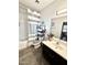 Bathroom featuring a bathtub with a shower, single sink vanity, and wood-look flooring in a neutral color palette at 2715 E Canyon Creek Dr, Gilbert, AZ 85295