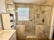 Elegant bathroom featuring a spacious glass shower with decorative tile and ample storage at 2715 E Canyon Creek Dr, Gilbert, AZ 85295