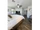 Bedroom with wood-look tile flooring, ceiling fan, and an ensuite bathroom at 2715 E Canyon Creek Dr, Gilbert, AZ 85295