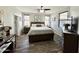Calm primary bedroom with wood-look floors and a ceiling fan offering great natural light at 2715 E Canyon Creek Dr, Gilbert, AZ 85295