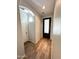 Inviting entryway with wood-look tile flooring, neutral walls, and decorative front door with glass inserts at 2715 E Canyon Creek Dr, Gilbert, AZ 85295