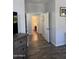 Hallway with wood floors leading to bathroom and bedrooms at 2715 E Canyon Creek Dr, Gilbert, AZ 85295