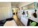 Hallway with door, view of the bathroom, and art-covered walls at 2715 E Canyon Creek Dr, Gilbert, AZ 85295