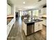 Spacious kitchen with an island, stainless steel appliances, and view of the open-concept living area at 2715 E Canyon Creek Dr, Gilbert, AZ 85295