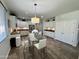 Bright eat-in kitchen features a glass table with seating and modern cabinetry at 2715 E Canyon Creek Dr, Gilbert, AZ 85295
