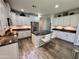 Modern kitchen features white cabinets, stainless steel appliances, granite countertops, and an island at 2715 E Canyon Creek Dr, Gilbert, AZ 85295