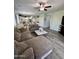 Spacious living room area with tile flooring and an open-concept layout into the kitchen at 2715 E Canyon Creek Dr, Gilbert, AZ 85295