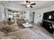Cozy living room featuring comfortable seating, a ceiling fan and plenty of natural light at 2715 E Canyon Creek Dr, Gilbert, AZ 85295