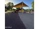 Shaded community playground featuring multiple slides and play structures for Gathering fun at 2715 E Canyon Creek Dr, Gilbert, AZ 85295