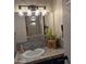 Stylish bathroom vanity with a decorative mirror and custom tile work at 2946 N 14Th N St # 14, Phoenix, AZ 85014