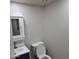 Cozy powder room featuring a pedestal sink and toilet with white walls at 2946 N 14Th N St # 14, Phoenix, AZ 85014