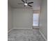 Spacious bedroom with neutral carpet, a ceiling fan, and a bright window at 2946 N 14Th N St # 14, Phoenix, AZ 85014