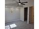 Bedroom with neutral walls, carpet, ceiling fan, closet, and ample lighting at 2946 N 14Th N St # 14, Phoenix, AZ 85014