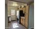 Bright kitchen with stainless steel appliances, wood cabinets, and a back door at 2946 N 14Th N St # 14, Phoenix, AZ 85014