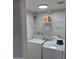 A functional laundry room with a washing machine and dryer at 2946 N 14Th N St # 14, Phoenix, AZ 85014