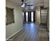 Open living room with hardwood-style flooring, a ceiling fan, and a staircase to the second level at 2946 N 14Th N St # 14, Phoenix, AZ 85014