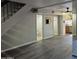 Neutral living room with stairs, vinyl flooring, and passage to the kitchen at 2946 N 14Th N St # 14, Phoenix, AZ 85014