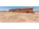 Desert backyard with solar panels and a central air conditioning unit at 31515 W Buchanan St, Buckeye, AZ 85326