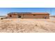 Backyard with solar panels on roof and desert landscape at 31515 W Buchanan St, Buckeye, AZ 85326