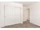 Bedroom with sliding closet doors, carpet, and natural light at 31515 W Buchanan St, Buckeye, AZ 85326