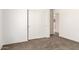 Bright bedroom features neutral carpet and a closet with sliding doors at 31515 W Buchanan St, Buckeye, AZ 85326