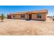 Single story home showcasing a desert landscape and two car garage at 31515 W Buchanan St, Buckeye, AZ 85326