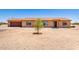 Tan single story home with a two car garage and desert landscaping at 31515 W Buchanan St, Buckeye, AZ 85326
