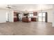 Open concept floor plan with kitchen island and modern appliances at 31515 W Buchanan St, Buckeye, AZ 85326