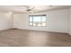 Living room featuring wood look flooring and natural light at 31515 W Buchanan St, Buckeye, AZ 85326