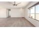 Living room featuring wood look flooring, natural light and ceiling fan at 31515 W Buchanan St, Buckeye, AZ 85326
