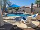Inviting backyard pool with poolside loungers and desert landscaping at 316 W Anderson Ave, Phoenix, AZ 85023
