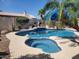 Sparkling backyard pool with integrated spa and a charming landscaped border at 316 W Anderson Ave, Phoenix, AZ 85023