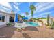 Lush backyard showcasing the pool with sun loungers and mature desert landscaping at 316 W Anderson Ave, Phoenix, AZ 85023