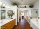 This primary bathroom has a dual sink vanity, glass-enclosed shower, and separate tub at 316 W Anderson Ave, Phoenix, AZ 85023
