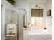 This bathroom features a glass-enclosed shower and soaking tub by a window at 316 W Anderson Ave, Phoenix, AZ 85023