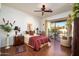 This spacious bedroom features a ceiling fan and sliding glass doors to the backyard patio at 316 W Anderson Ave, Phoenix, AZ 85023